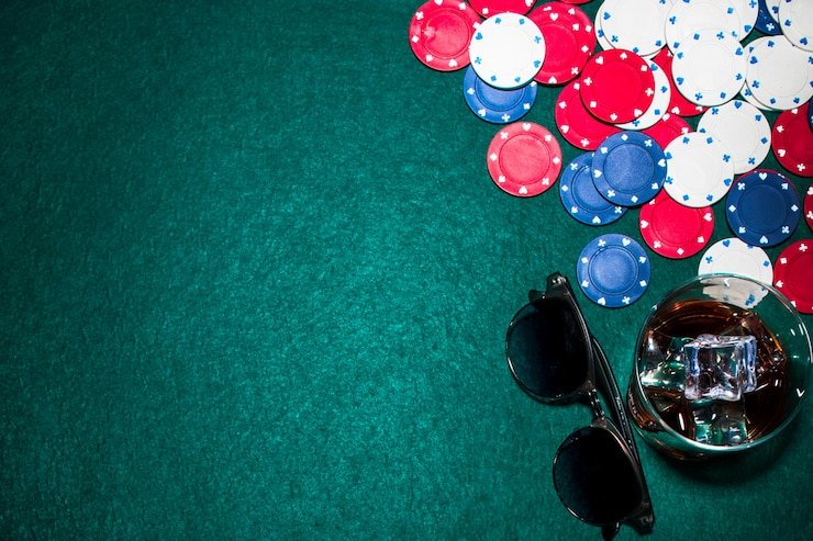 Live casino dealer at baccarat table with cards and chips visible